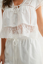 Load image into Gallery viewer, White lace top with a plain background