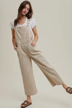 Load image into Gallery viewer, Woman wearing a checkered overalls and white t-shirt on a plain background