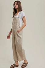 Load image into Gallery viewer, Woman wearing a checkered overalls and white shirt on a plain background