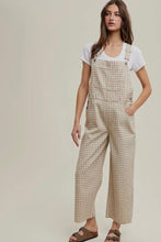 Load image into Gallery viewer, Woman wearing checkered overalls and a white shirt on a plain background