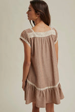 Load image into Gallery viewer, Woman wearing a brown striped dress with lace trim on a plain background