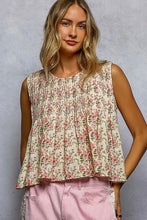 Load image into Gallery viewer, Woman wearing a floral sleeveless top and pink pants against a gray background