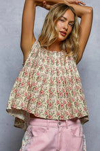 Load image into Gallery viewer, Woman wearing a floral top and pink pants against a gray background