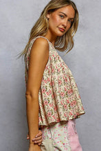 Load image into Gallery viewer, Woman wearing a floral sleeveless top and pink pants against a gray background