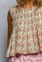 Load image into Gallery viewer, Floral sleeveless top worn by a person against a neutral background