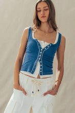 Load image into Gallery viewer, Woman wearing a blue denim vest over a white top and pants on a neutral background