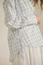 Load image into Gallery viewer, Plaid shirt with a tie detail worn by a person, on a plain background