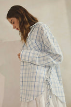 Load image into Gallery viewer, Woman wearing a light blue checkered shirt against a plain background