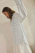 Load image into Gallery viewer, Woman wearing a blue and white checkered shirt with sheer sleeves against a plain background