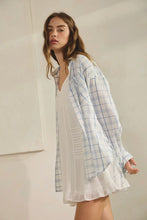 Load image into Gallery viewer, Woman wearing a white dress with a blue plaid shirt over it against a plain background