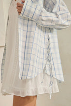 Load image into Gallery viewer, Person wearing a light-colored outfit with a plaid shirt over a white lace top.