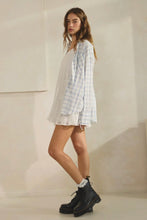 Load image into Gallery viewer, Woman wearing a plaid shirt over a white dress with black boots against a plain background