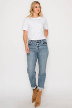 Load image into Gallery viewer, Woman wearing a white t-shirt, blue jeans, and brown boots on a white background