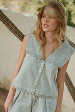Load image into Gallery viewer, Woman wearing a light blue denim vest outdoors