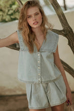 Load image into Gallery viewer, Woman wearing a light denim sleeveless top and shorts set outdoors.