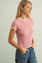 Load image into Gallery viewer, Woman wearing a pink t-shirt and blue jeans against a plain background