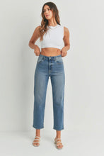Load image into Gallery viewer, Woman wearing a white crop top and blue jeans on a plain background