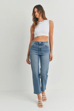 Load image into Gallery viewer, Woman wearing a white crop top and blue jeans on a plain background
