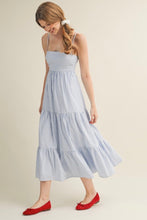 Load image into Gallery viewer, Woman wearing a light blue striped dress with red shoes on a plain background