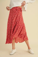 Load image into Gallery viewer, Person wearing a red floral skirt and white sneakers on a beige background