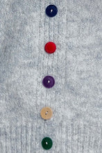 Load image into Gallery viewer, Close-up of a light gray knit fabric with five colorful buttons aligned vertically in the center: navy blue, red, purple, tan, and green.