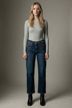 Load image into Gallery viewer, Woman wearing a gray long-sleeve top and blue jeans against a neutral background