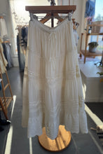 Load image into Gallery viewer, White lace dress on a mannequin in a store setting