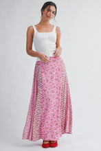 Load image into Gallery viewer, Woman wearing a white top and pink floral skirt on a white background