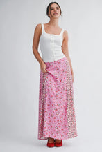 Load image into Gallery viewer, Woman wearing a white top and pink floral skirt on a white background