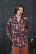 Load image into Gallery viewer, Woman wearing a plaid shirt against a plaid wall