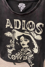 Load image into Gallery viewer, Black t-shirt with graphic design of a woman in a cowboy hat and the text 'Adios Cowboy' on a beige background.