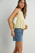 Load image into Gallery viewer, Woman wearing a yellow top and denim skirt on a plain background