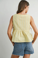 Load image into Gallery viewer, Woman wearing a yellow sleeveless top and denim shorts on a plain background