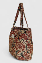 Load image into Gallery viewer, Floral patterned tote bag on a light gray background