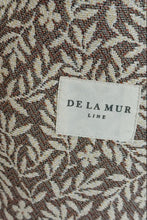 Load image into Gallery viewer, Fabric with a subtle pattern and &#39;De La Mur&#39; label