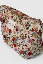 Load image into Gallery viewer, Floral patterned pouch with a visible brand label on a white background