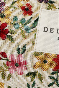 Floral patterned fabric with a label on a beige background