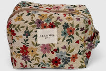 Load image into Gallery viewer, Floral patterned toiletry bag with &#39;DE LAMUR&#39; label on a light gray background