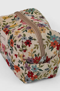 Floral-patterned cosmetic bag with a zipper on a white background