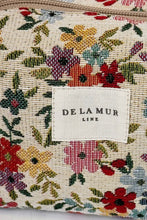 Load image into Gallery viewer, Floral-patterned pouch with &#39;DE LA MUR LINE&#39; label on a white background