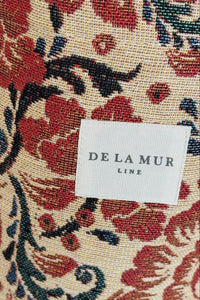 Floral patterned fabric with 'DE LA MUR' label