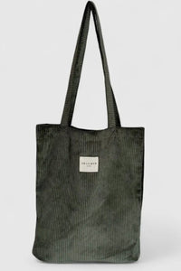 Green corduroy tote bag with a visible brand label on a white background
