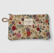 Load image into Gallery viewer, Floral patterned pouch with &#39;De La Mur&#39; label on a white background
