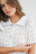 Load image into Gallery viewer, Woman wearing a light blue knitted dress with a collar against a white background