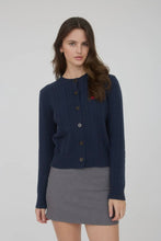 Load image into Gallery viewer, Woman wearing a navy blue cardigan over a gray skirt on a white background