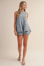 Load image into Gallery viewer, Woman wearing a denim dress on a beige background