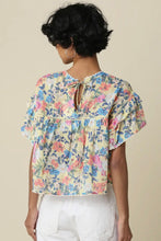Load image into Gallery viewer, Woman wearing a floral blouse with a neutral background