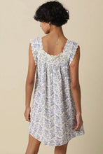 Load image into Gallery viewer, Woman wearing a floral dress with lace details on a beige background