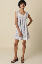 Load image into Gallery viewer, Woman wearing a floral dress against a plain background