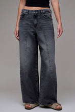 Load image into Gallery viewer, Person wearing wide-leg jeans on a plain background